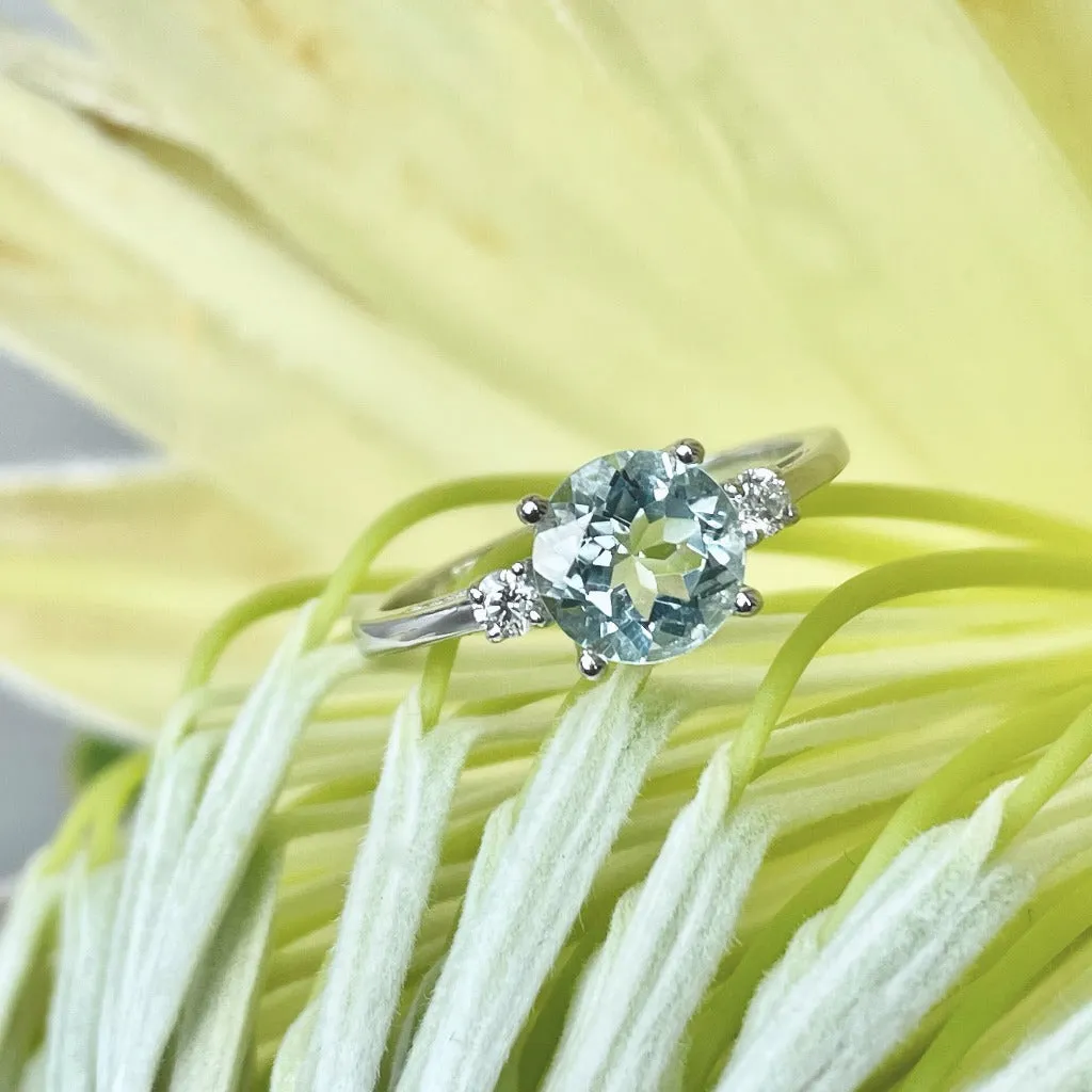 Elegant Round Cut Aquamarine and Accent Diamond Ring