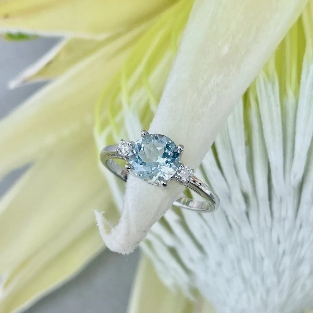 Elegant Round Cut Aquamarine and Accent Diamond Ring