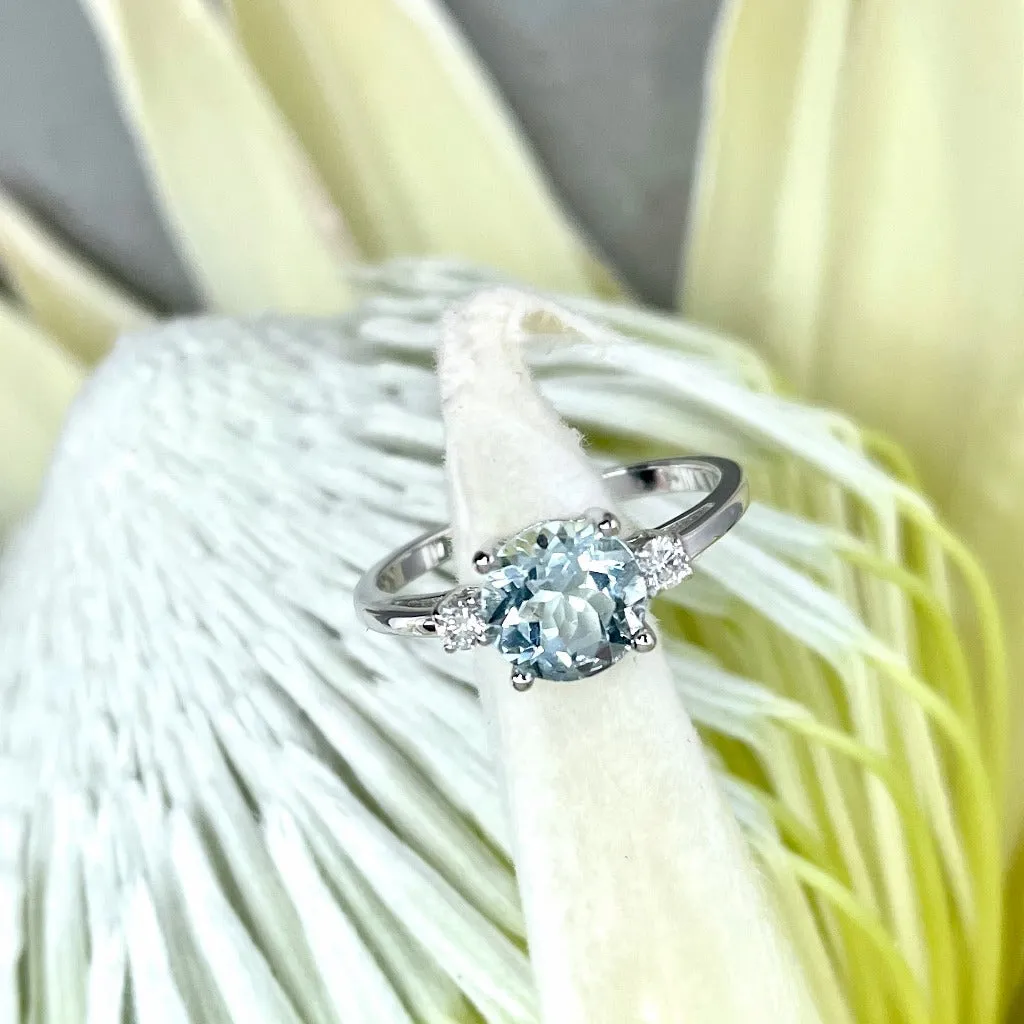 Elegant Round Cut Aquamarine and Accent Diamond Ring